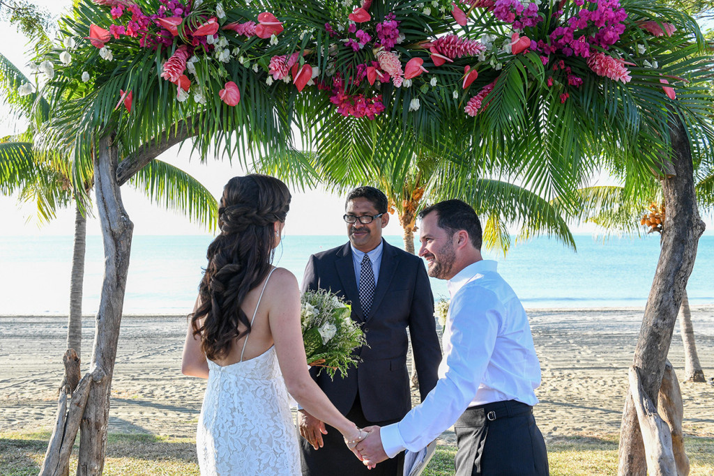 Bride and groom at altar of beach Fiji wedding ceremony at Sofitel Fiji