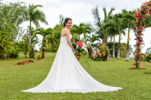 Stunning large white gown of German bride on the green lawn of Savusavu Island Fiji