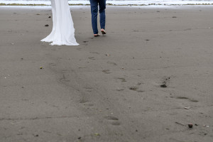 Footprints left in the sand left by married couple on Savusavu Island Fiji