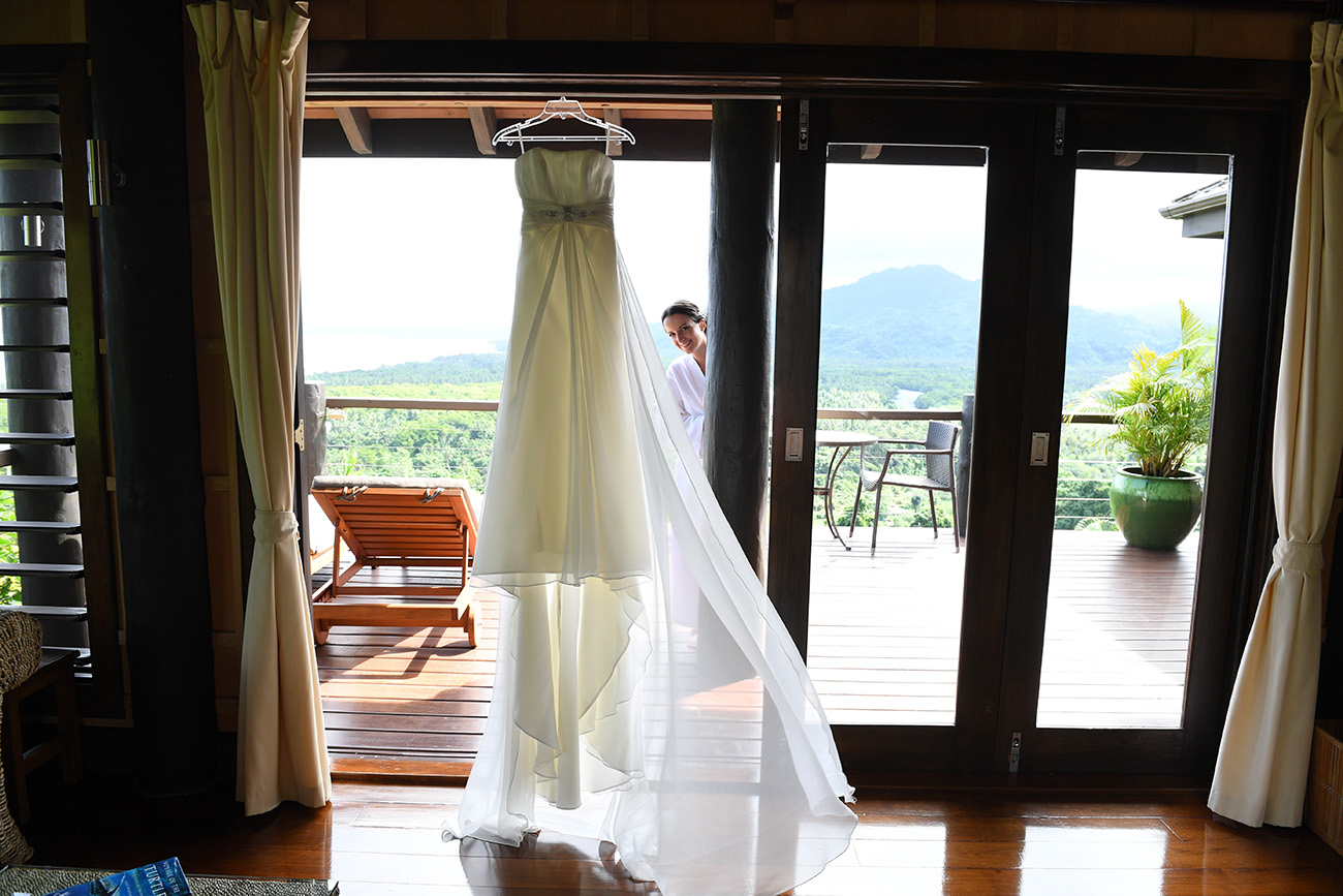The bridal gown draped on the doorway of the bride's hotel room in Savusavu Island Fiji