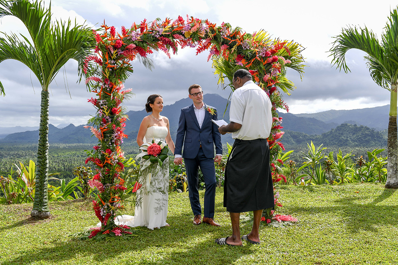 Bride and groom at the altar listening to the Fiji celebrant