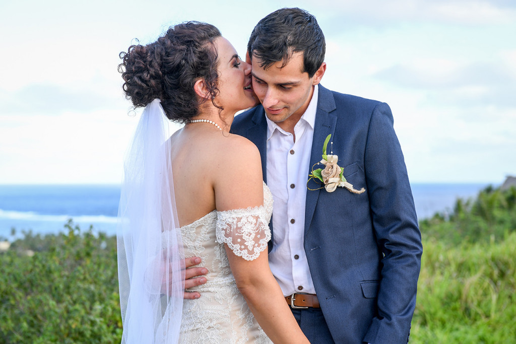 Bride whispers to her groom at the Outrigger Fiji