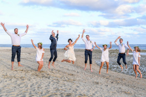 Bridal party jump into the air at the Outrigger Fiji