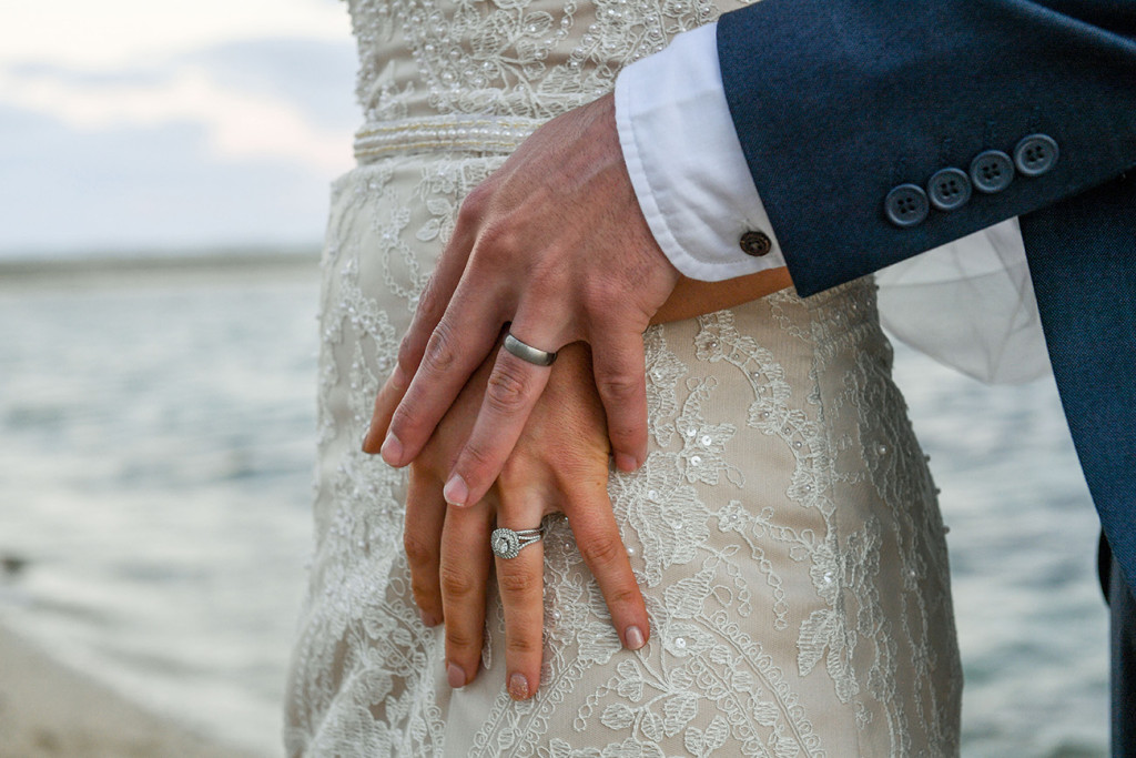 Closeup of gold rings on bride and groom at the boho wedding at the Outrigger Fiji