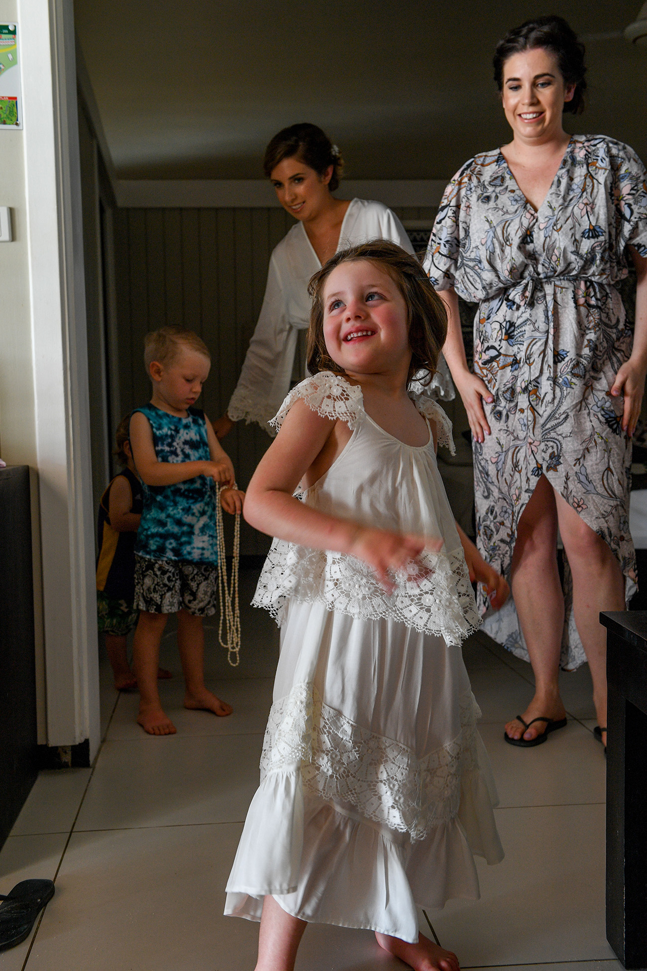 Flowergirl dances in her white lace dress