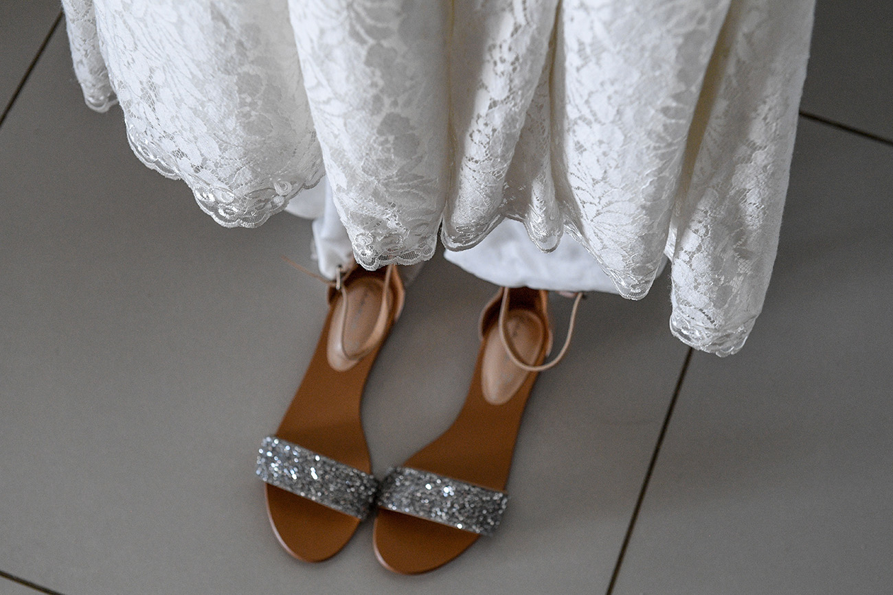 Bejewelled Silver sandals of the bride