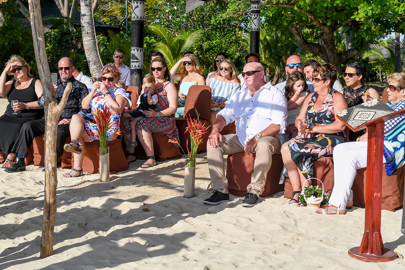 Wedding guests at the outdoor traditional Fiji beach wedding