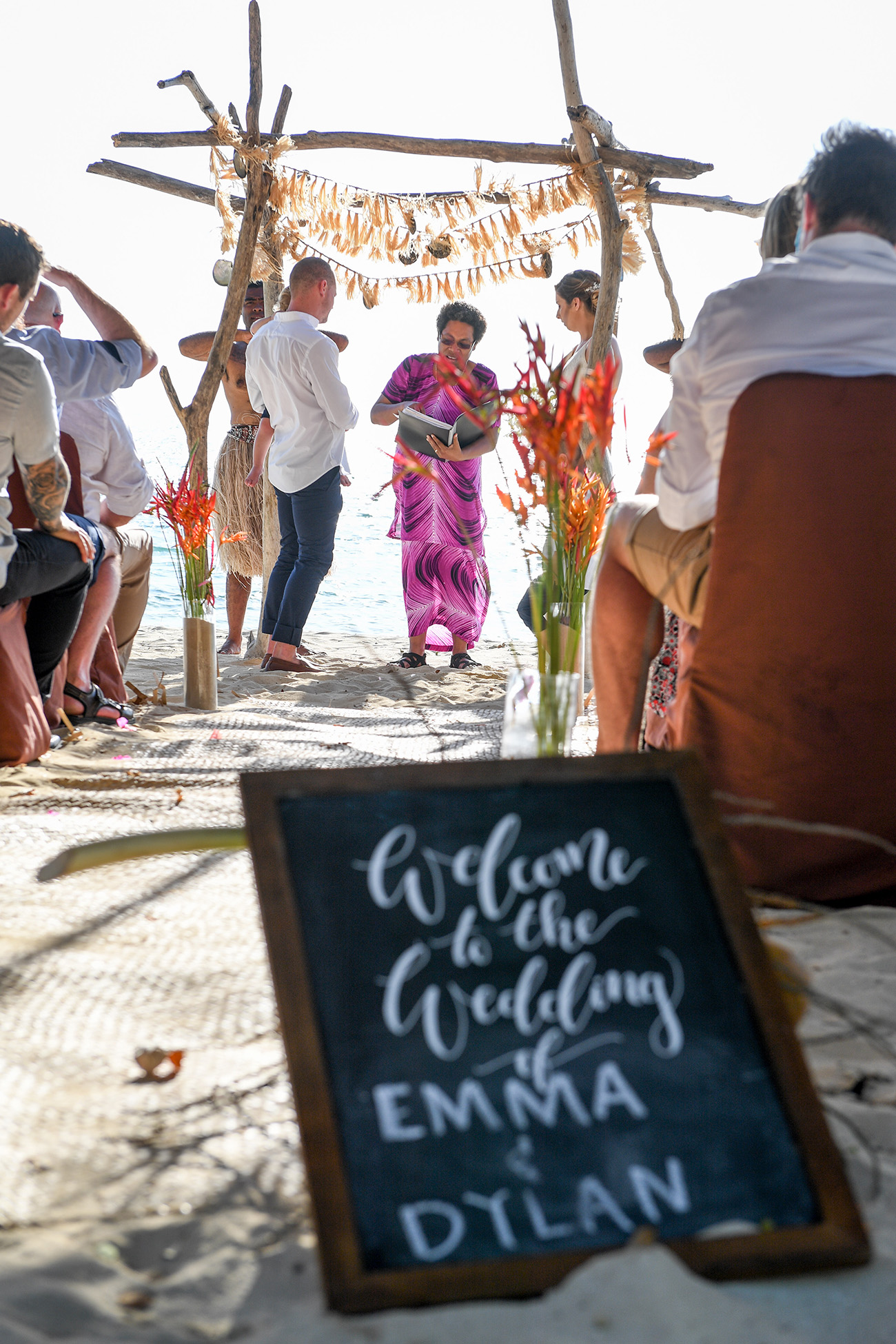 Emma & Dylan ceremony with a welcome chalkboard placard at the wedding ceremony venue.