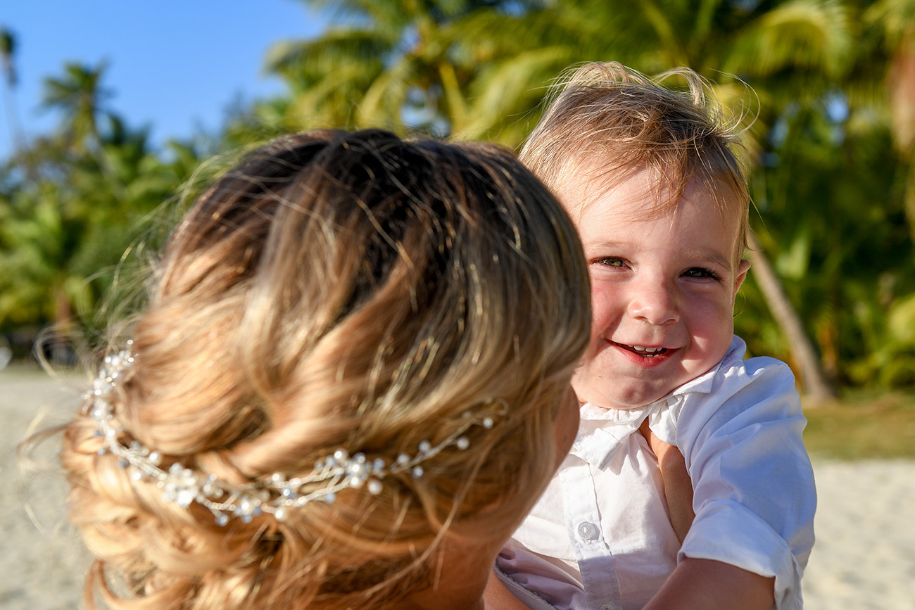 The bride plays with her son at the Plantation Island Resort Fiji