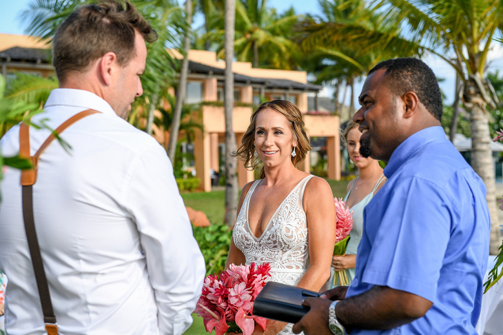 The groom receives the bride at the altar at the Sheraton Denarau Fiji