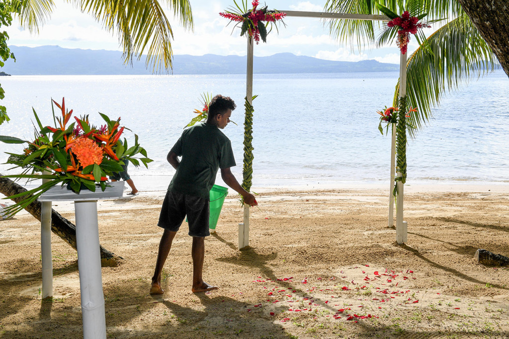 rose petals on white sand for the wedding ceremony, at Matangi island resort Fiji