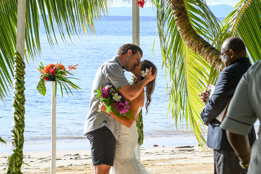 First kiss of the wedding couple at the end of the ceremony, Matangi Fiji