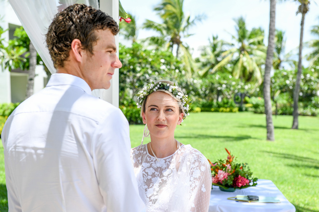 Bride stares lovingly at her husband at the altar in Hilton Denarau Fiji