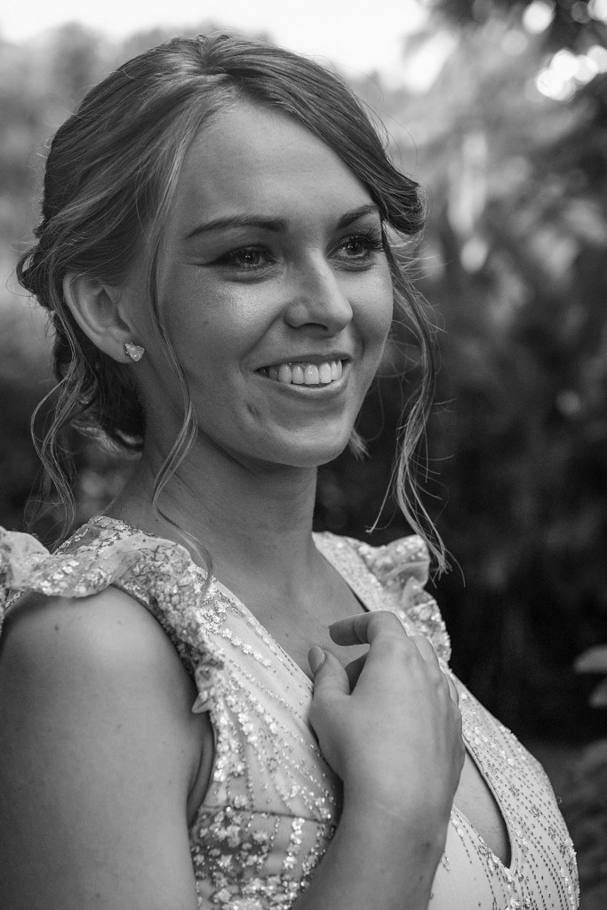 Monochrome photo of bride in full makeup