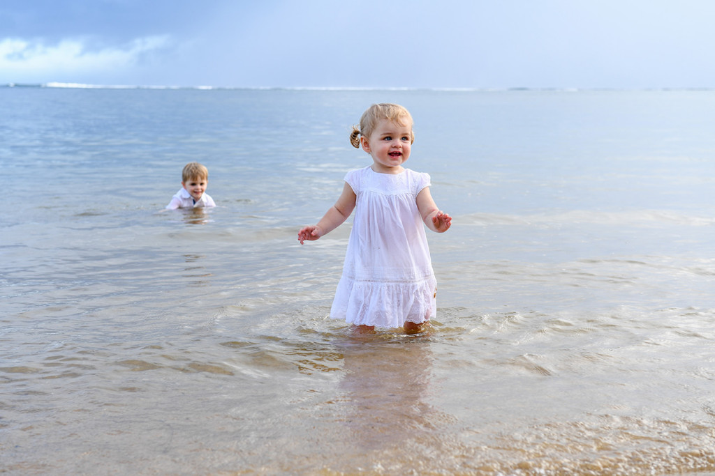 Cute baby girl playing in the sea