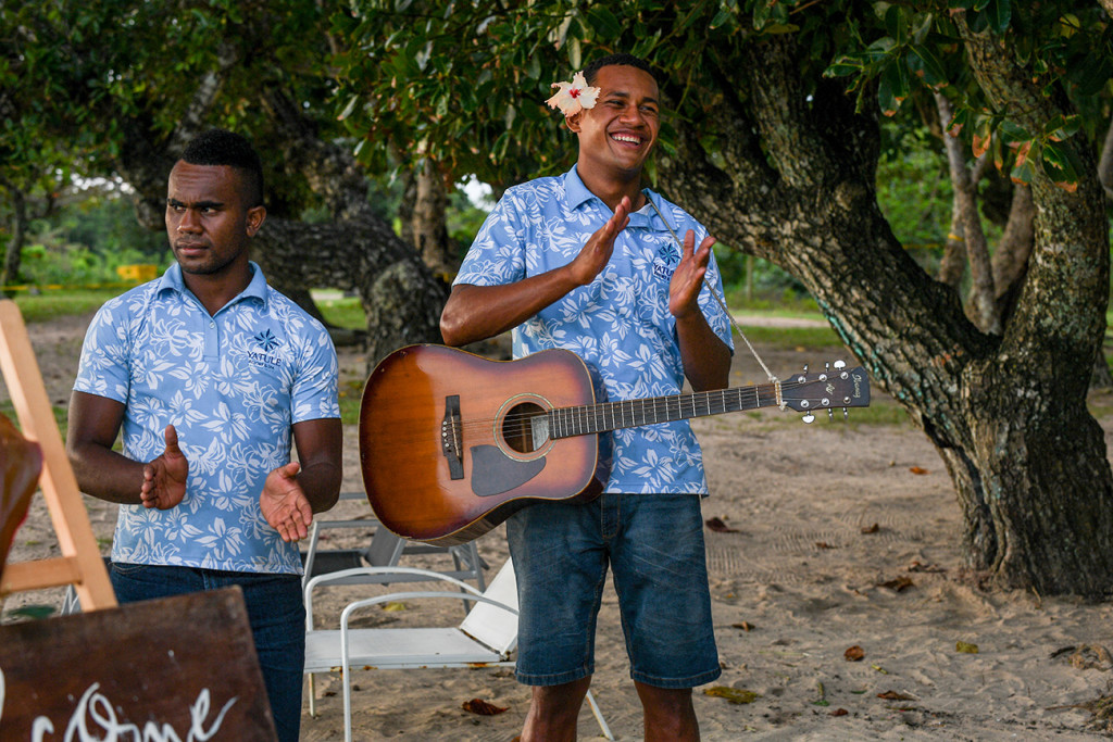 A happy guitarist of the Paradise Bride team in Fiji celebrates the newly weds