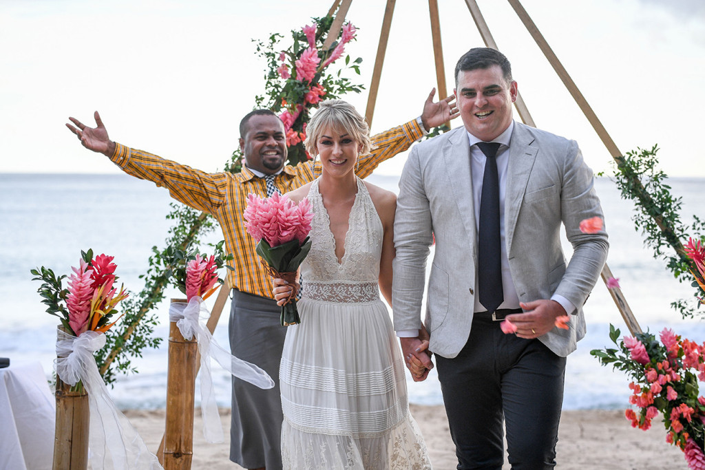 Finally married: The celebrant celebrates the newly weds as they walk down their boho style aisle