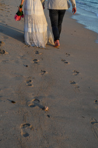 Bride and groom leave footprint in the sand at Yatule Resort Fiji