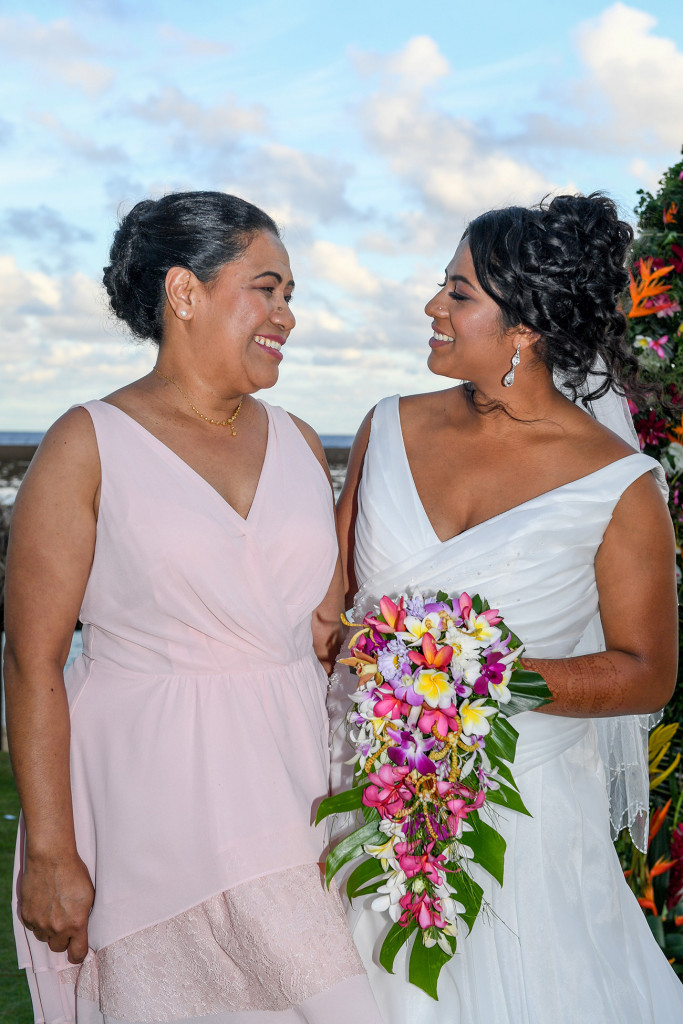 The bride smiles with her mother