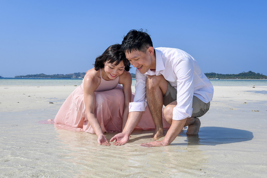The couple collects shells in the shallow waters of the reef at Malolo Lai Lai Island