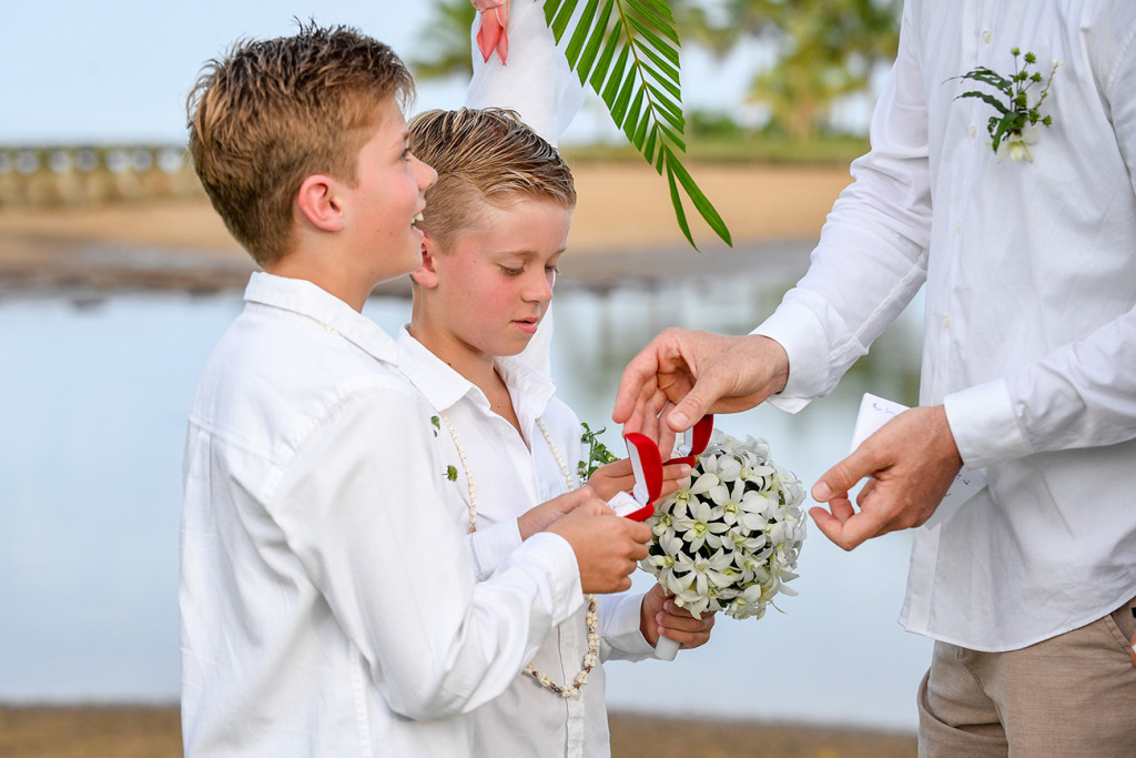 the best boys hand the groom the rings