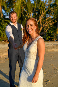 Sunkissed bride leads her husband at Musket Cove Fiji
