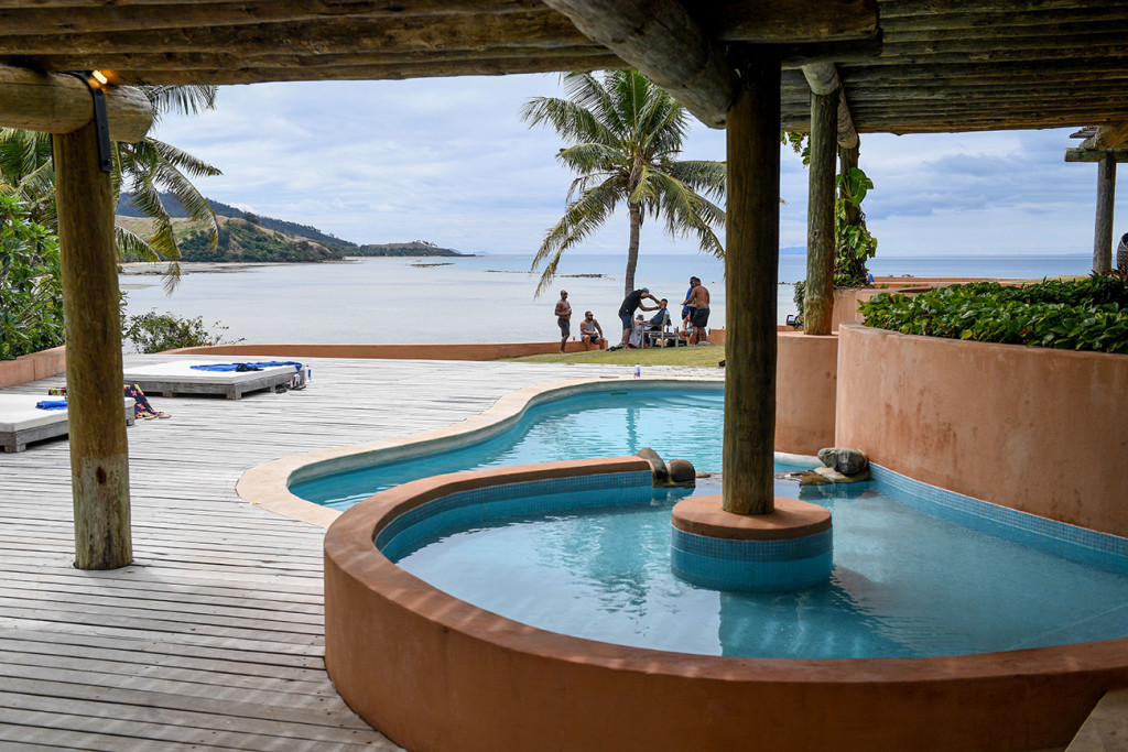 Curved infinity pool at the edge of the sea at the Musket cove island resort, Fiji