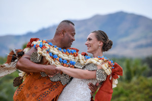 The newly married couple dance against the breathtaking landscape of Fiji