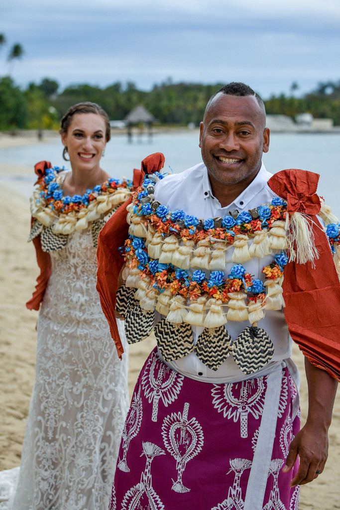 The stellar groom leads his bride on the shores of the Pacific