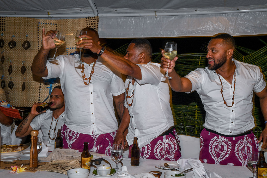 The groom and his groomsmen raise a toast to the speech giver