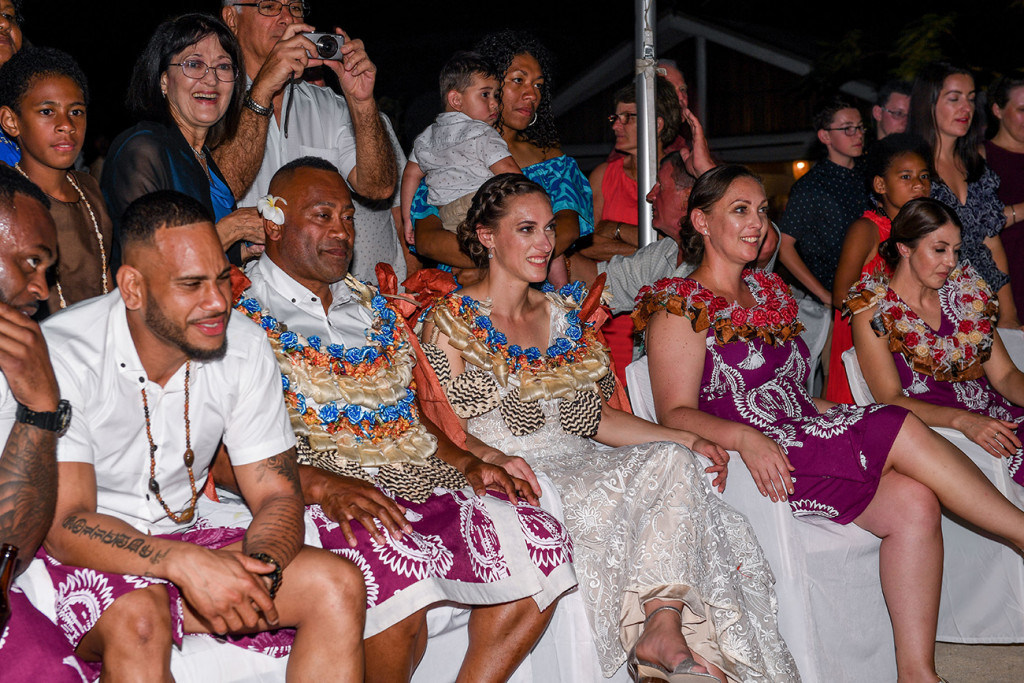 The newly married couple and their wedding guests watch the performances in awe
