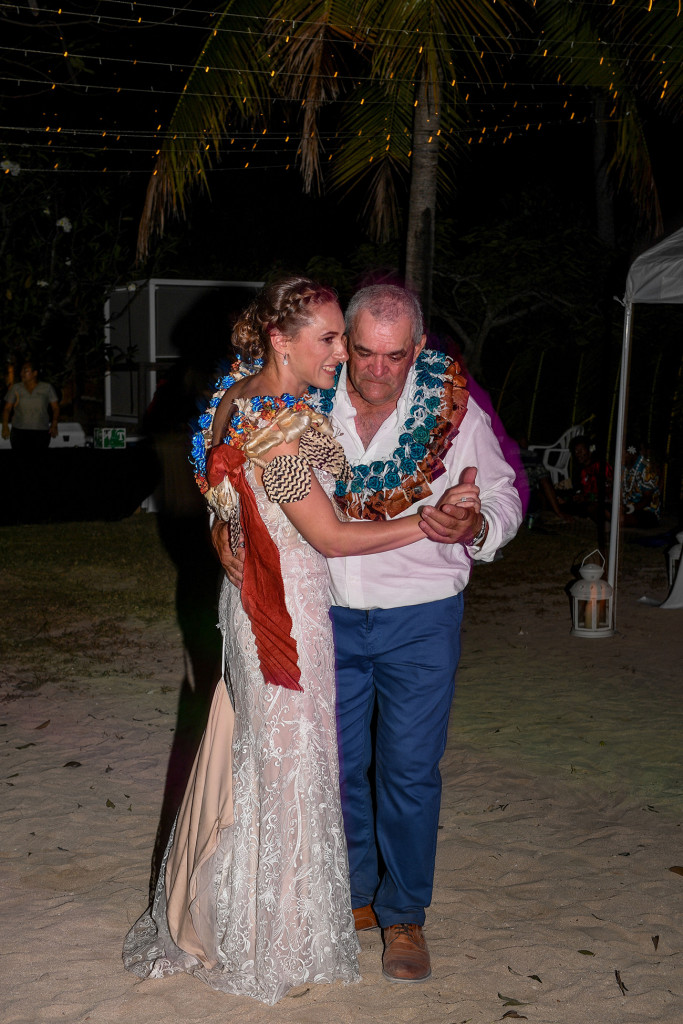Father and daughter share the first dance on the beach at Musket Cove