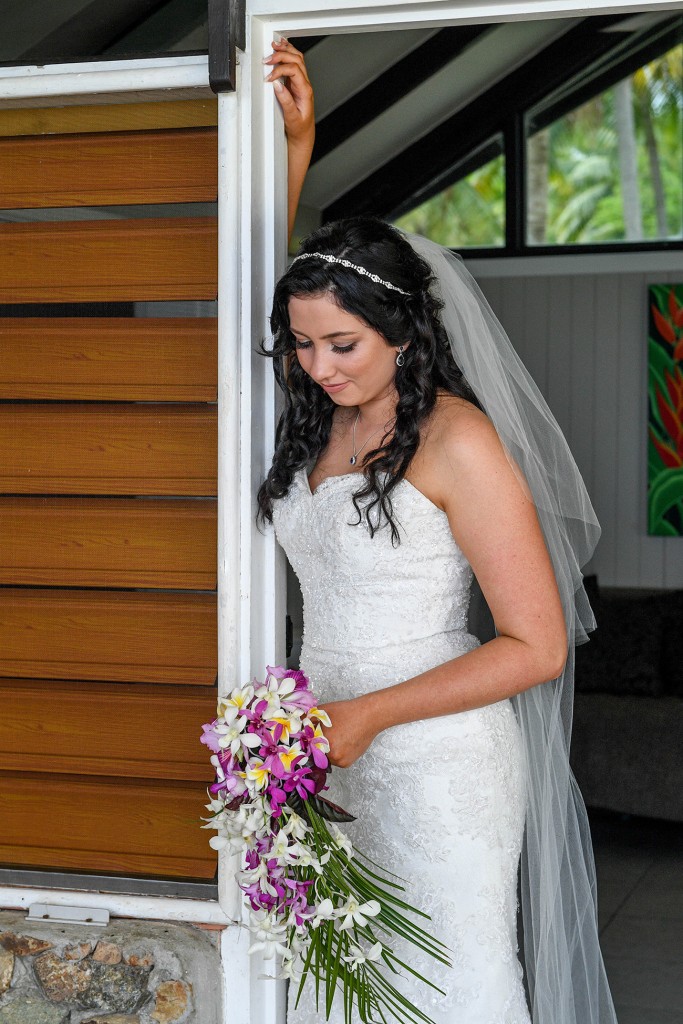 The stunning bride stands at the doorway
