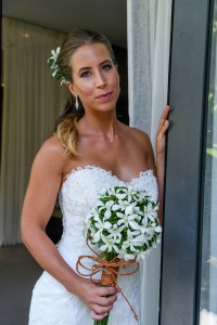 The stunning bride poses at the doorway