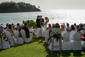 The couple exchange vows besides the Pacific Ocean