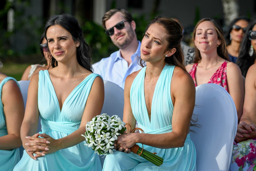 Bridesmaids watch in tears as they exchange vows