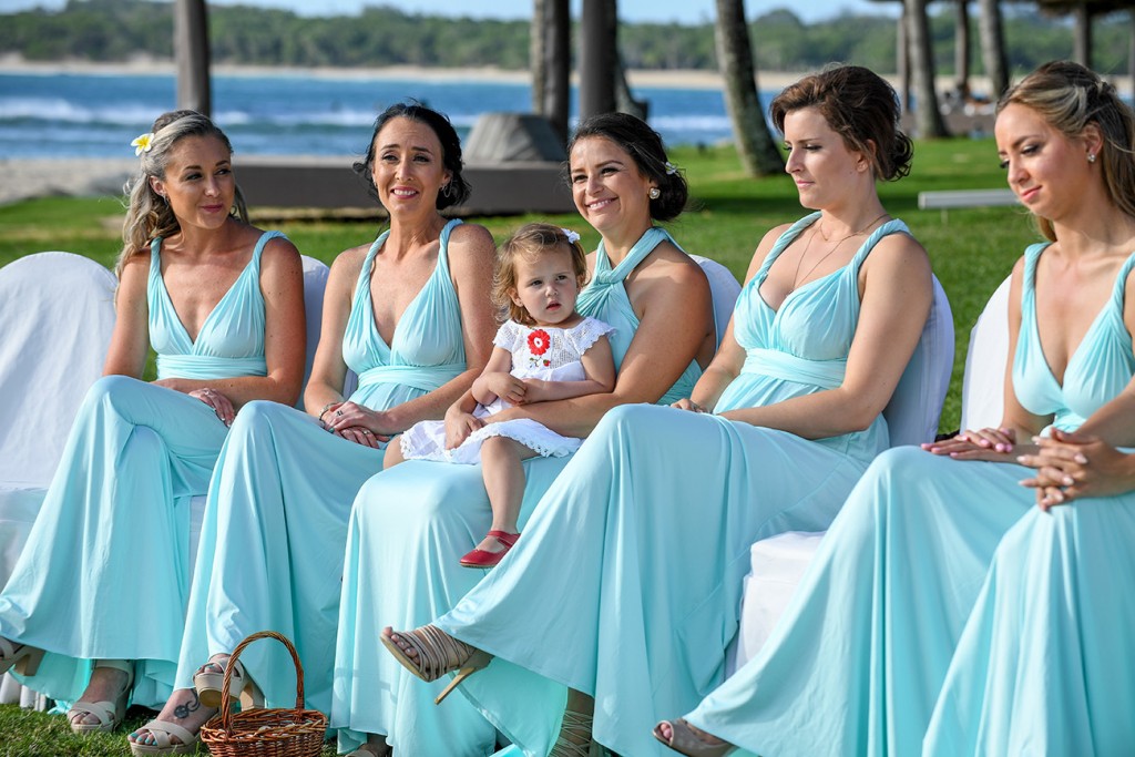A row of beautiful bridesmaids in turquoise blue