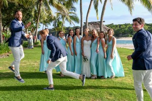 The groomsmen photobomb the bridesmaids pictures