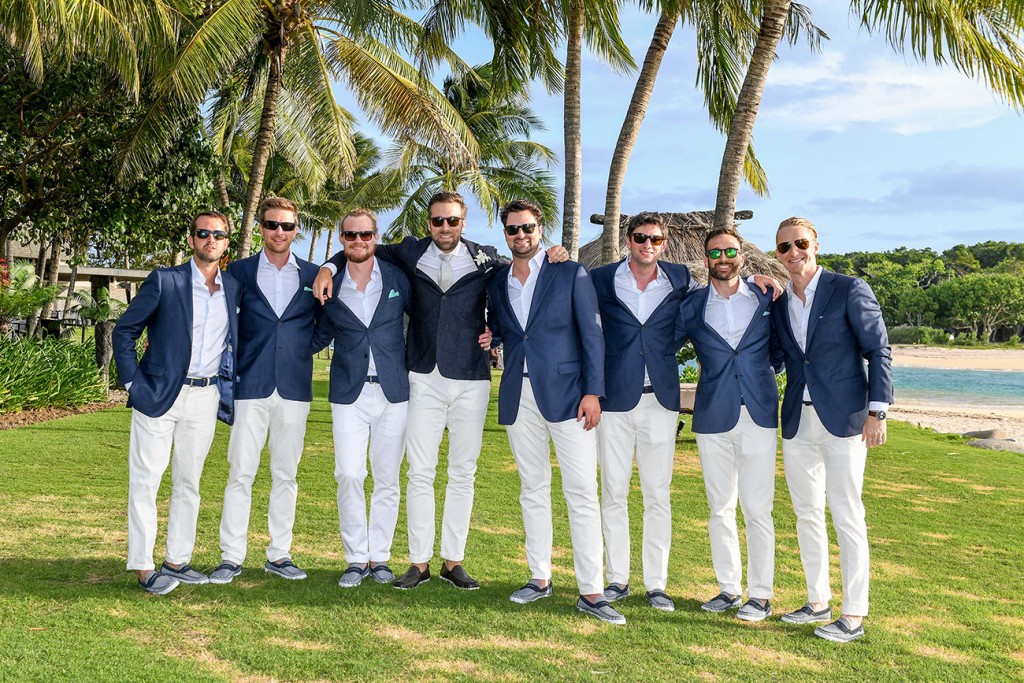 The groomsmen pose with their groom