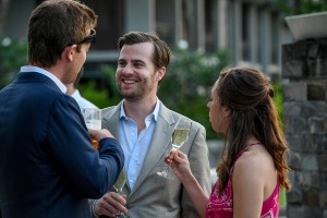 Wedding guests chat over a drink