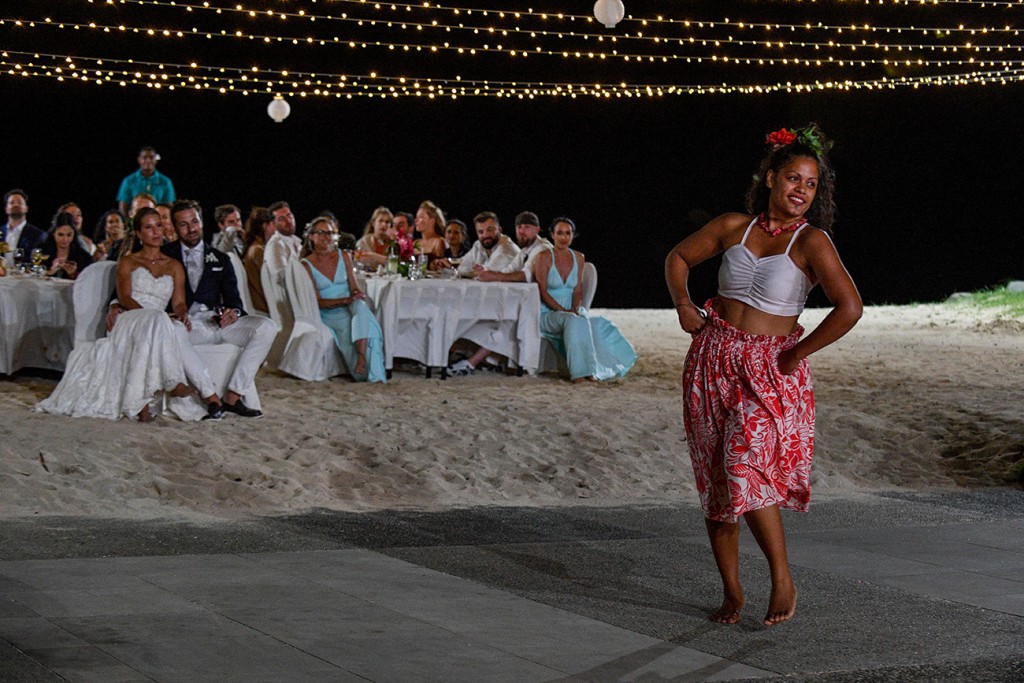 Guests watch a traditional Fiji dancer under fairy lights