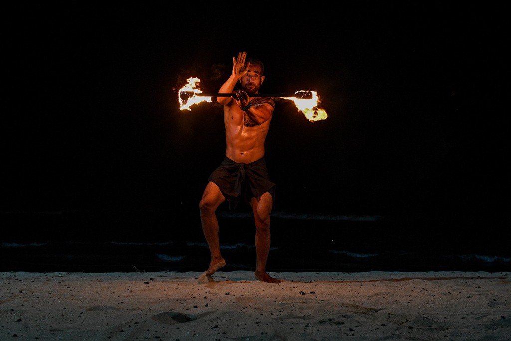 A fire dance is performed by a Rue Fiji dancer