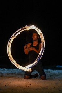 A traditional Fiji dancer from Rue Fiji performs a fire dance