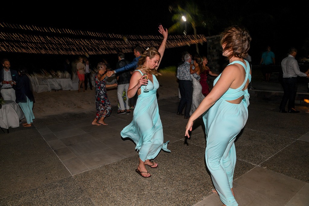 The bridesmaids dance wildly at the reception
