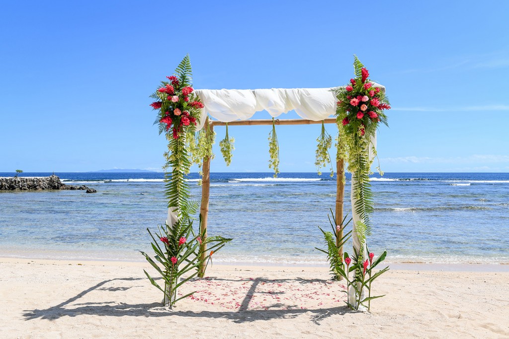The simple bamboo altar adorned with fresh tropical flowers