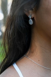 Stunning diamond earrings glisten off the bride's ears