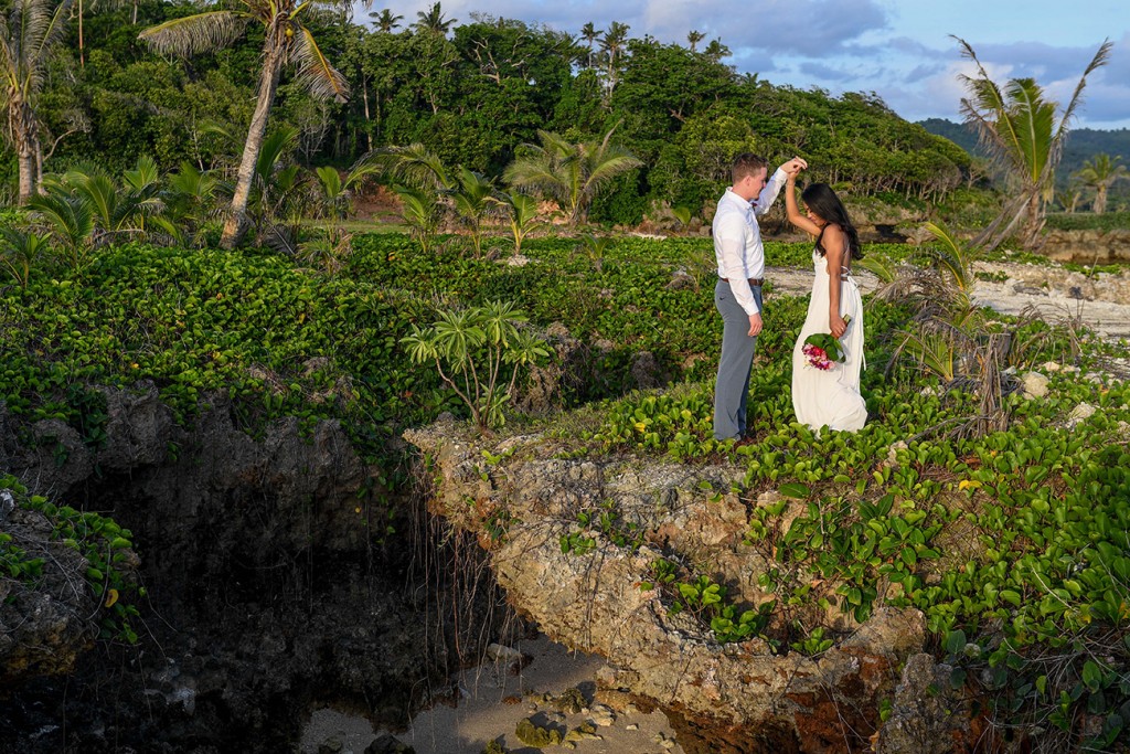 The couple dances atop a bed of green weeds