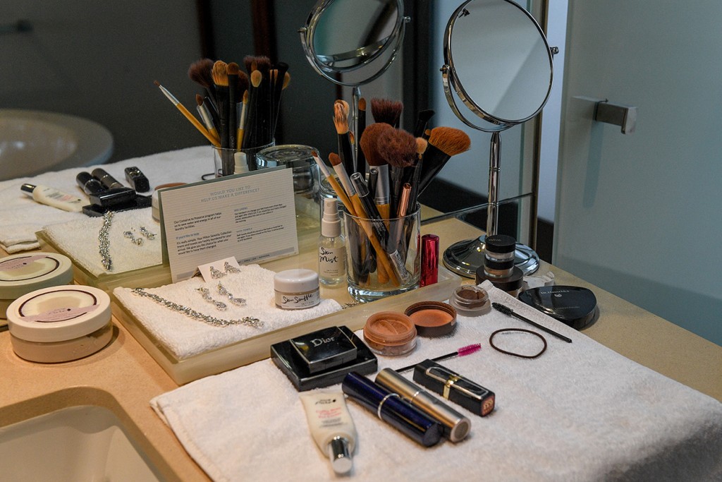 The bride's makeup spread in front of the dressing table