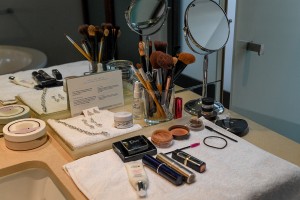 The bride's makeup spread in front of the dressing table