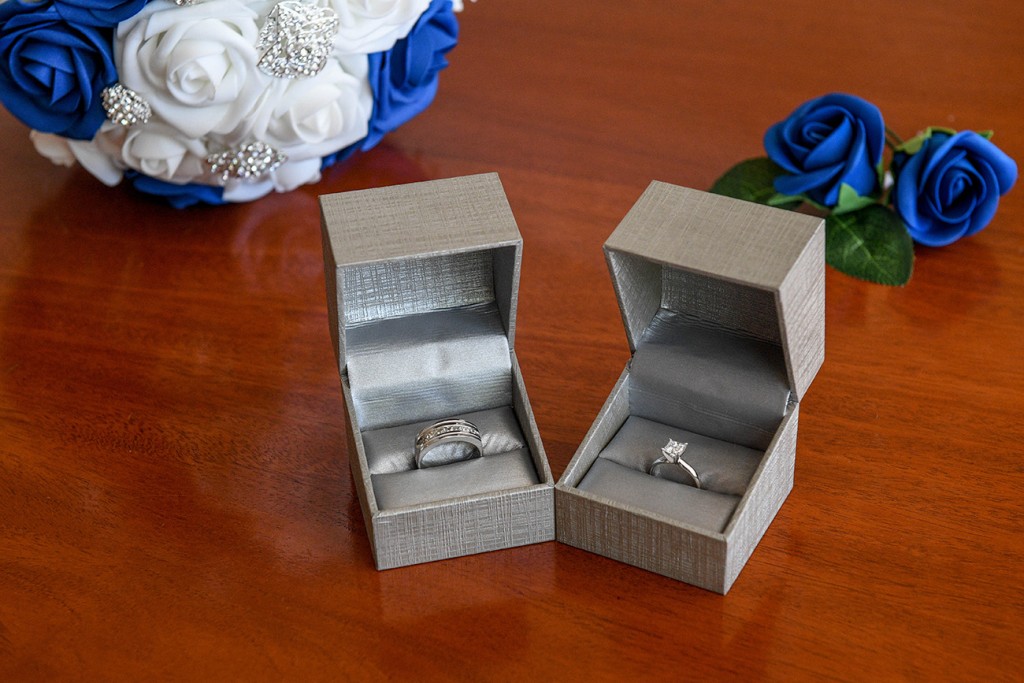Sparkling silver and diamond rings in metallic grey ring boxes